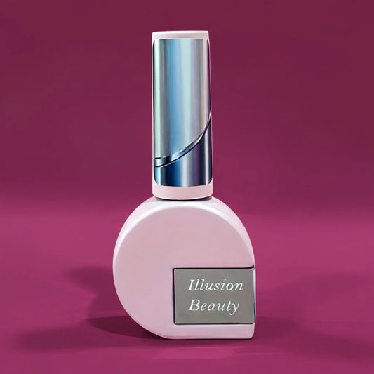 Top Chrome Transparente Illusion Beauty de 10 ml en envase rosa con tapón plateado.